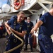 Heave! Swabs handle lines aboard CGC Eagle