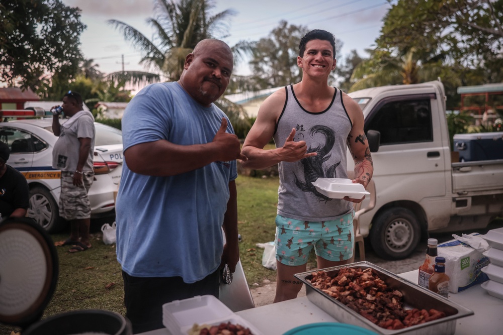 Dinner is Served: Marines enjoy a Mid-week meal with Peleliu Community