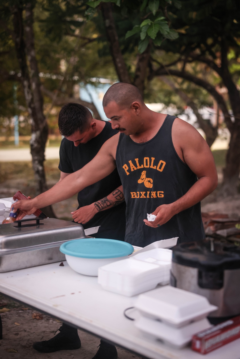 Dinner is Served: Marines enjoy a Mid-week meal with Peleliu Community