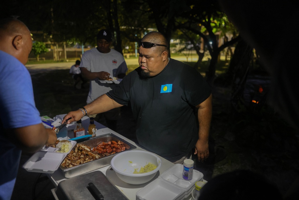 Dinner is Served: Marines enjoy a Mid-week meal with Peleliu Community