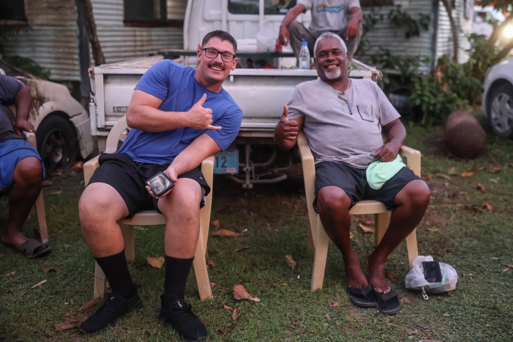 Dinner is Served: Marines enjoy a Mid-week meal with Peleliu Community