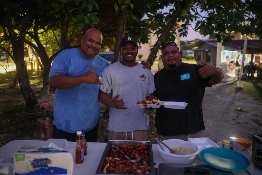 Dinner is Served: Marines enjoy a Mid-week meal with Peleliu Community