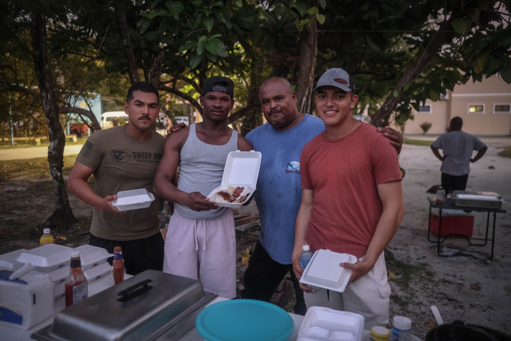 Dinner is Served: Marines enjoy a Mid-week meal with Peleliu Community