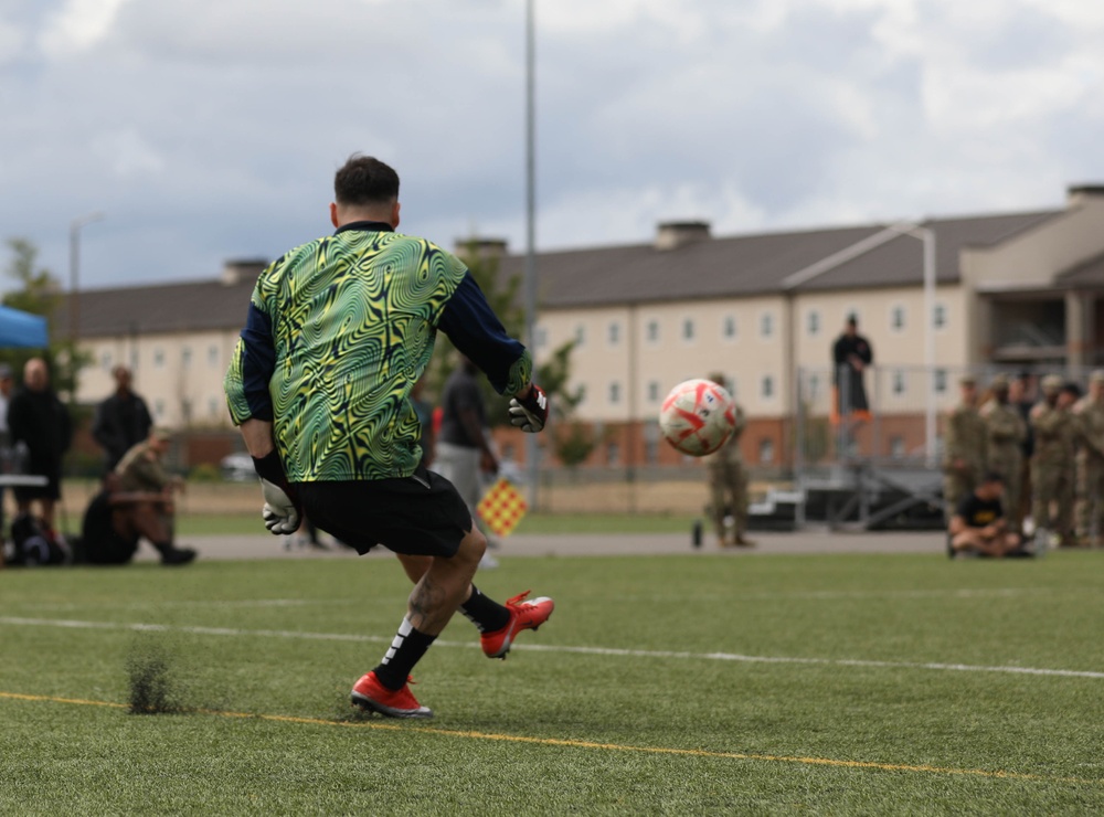 Kicking it: Soldiers play soccer