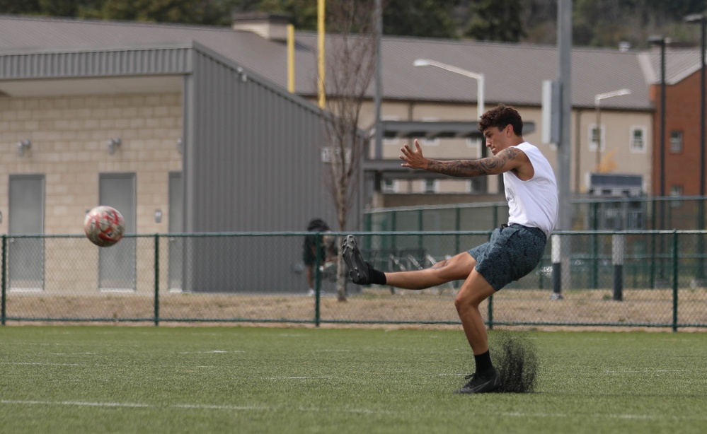 Kicking it: Soldiers play soccer