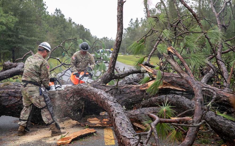 Florida National Guard soldiers clear road debris left in the wake of Hurricane Idalia