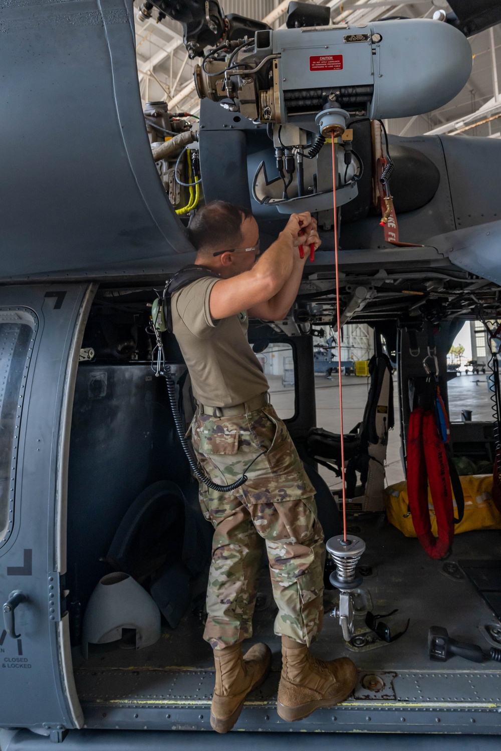 Hoist is removed from an HH-60G Pave Hawk helicopter