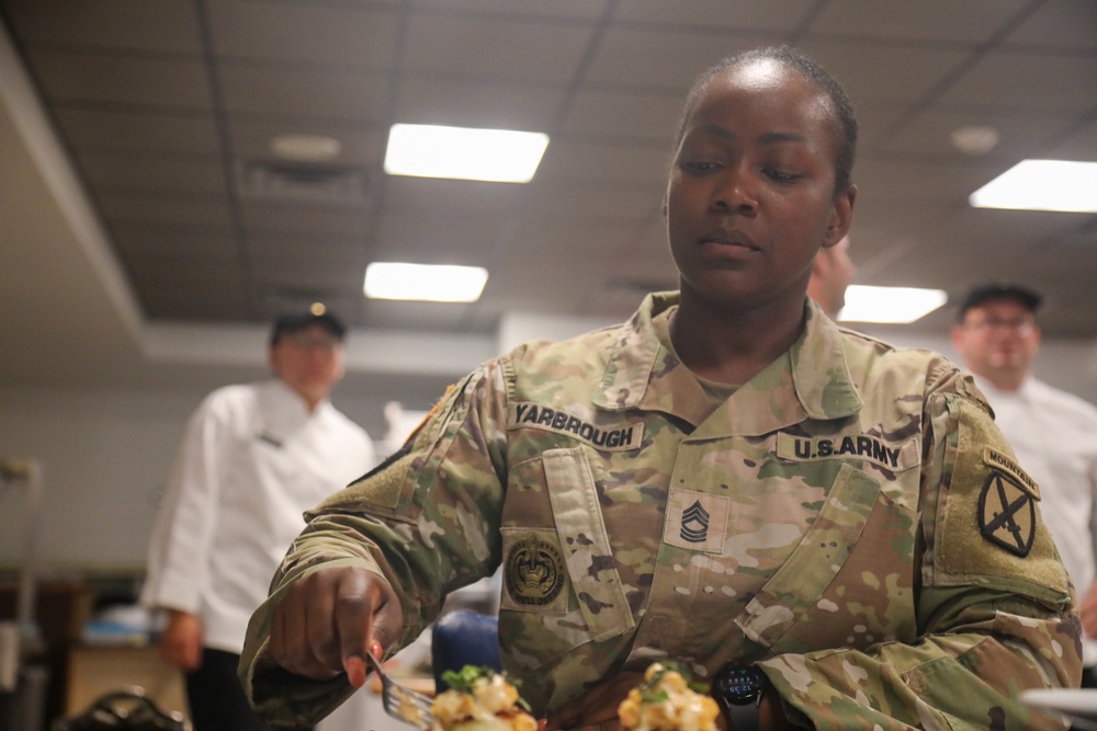 Master Sgt. Yarbrough Judges a Dish in the 10th Division Sustainment Brigade Culinary Challenge