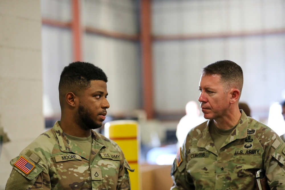 PFC Moore speaks to BG Curtis during a FORSCOM G4 Inspection