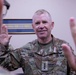 Lt. Gen. Patrick D. Frank, commanding general of U.S. Army Central, reenlists Spc. Nathan T. Rivera