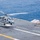Helicopter launches from USS Nimitz flight deck Helicopter launches from USS Nimitz flight deck