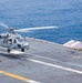 Helicopter launches from USS Nimitz flight deck