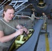 Britton installs KC-135 boom cable