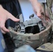 A competitor lays out their helmet during layout and inprocessing at the 2023 Army Reserve Best Squad Competition