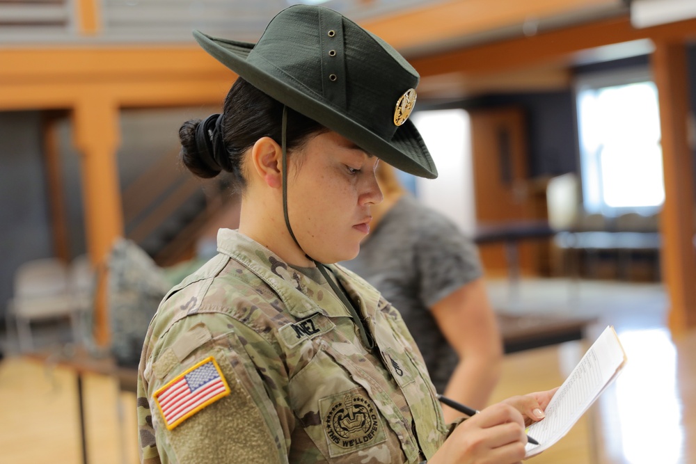 Staff Sgt. Melissa Jimenez oversees layout inprocessing for the 2023 U.S. Army Best Squad Competition