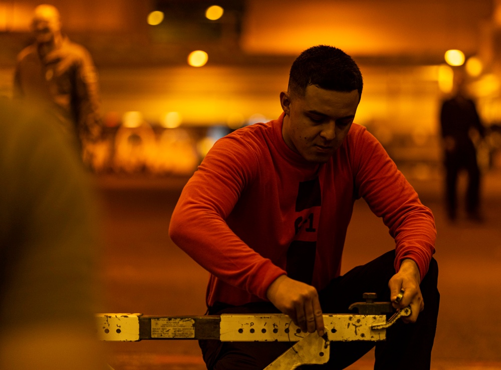 Sailors Disassembles Equipment