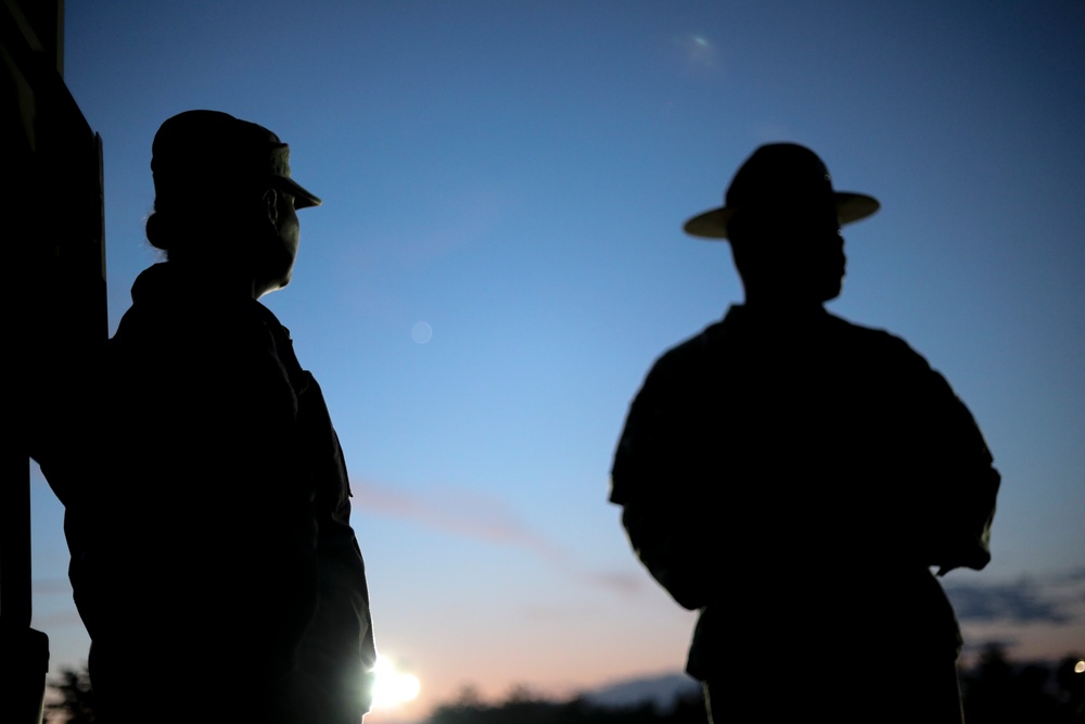 U.S. Army Reserve Best Squad Competition graders observe competitors