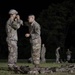 U.S. Army Reserve Spc. Nelson Medina assists Spc. Edgardo Santiago prior to an Expert Physical Fitness Assessment