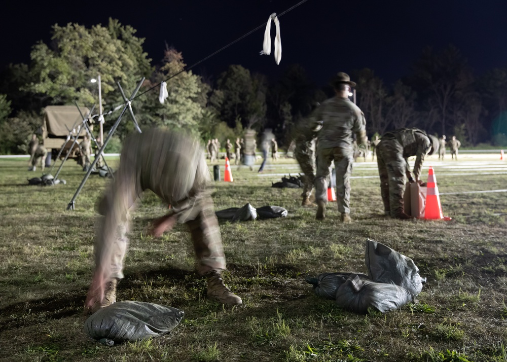 A U.S. Army Reserve soldier reaches for a sandbag during an Expert Physical Fitness Assessment