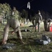 A U.S. Army Reserve soldier reaches for a sandbag during an Expert Physical Fitness Assessment