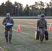 Army Reserve Spc. Jacob Fontenot performs a water jug carry during an Expert Physical Fitness Assessment