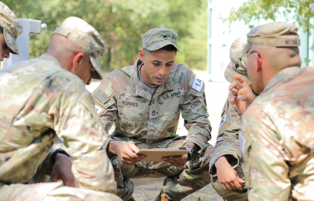 Sgt. 1st Class Juan Torres reads instructions