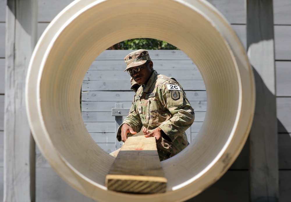 Sgt. Maynard Delphin participates in the Squad Leader Reaction Course