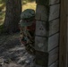 Cpl. Michael Glosemeyer simulates the steps a soldier takes prior to throwing a hand grenade.