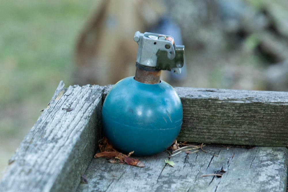 Army Reserve Best Squad competitors throw practice grenades