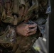 A U.S. Army Reserve Best Squad competitor simulates the steps a soldier takes prior to throwing a hand grenade.