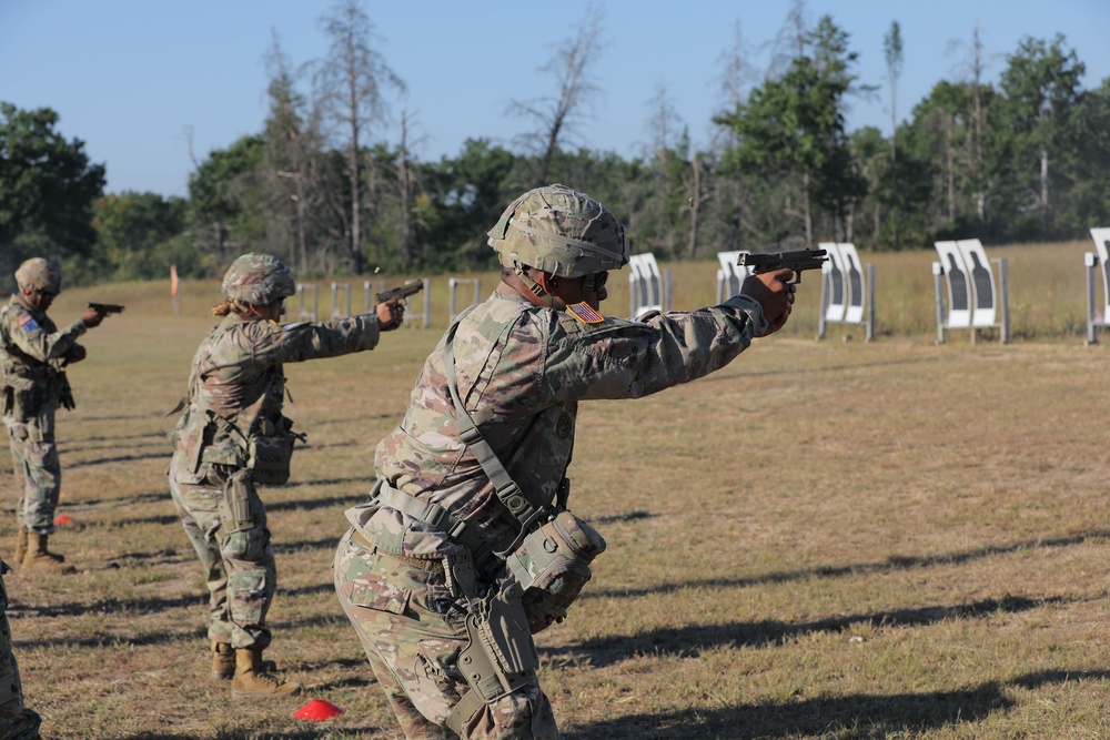 U.S. Army Reserve Best Squad Competitors shoot during the Pistol Expert in Competition event