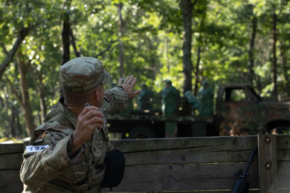 Sgt. Daniel Naes aims a practice grenade