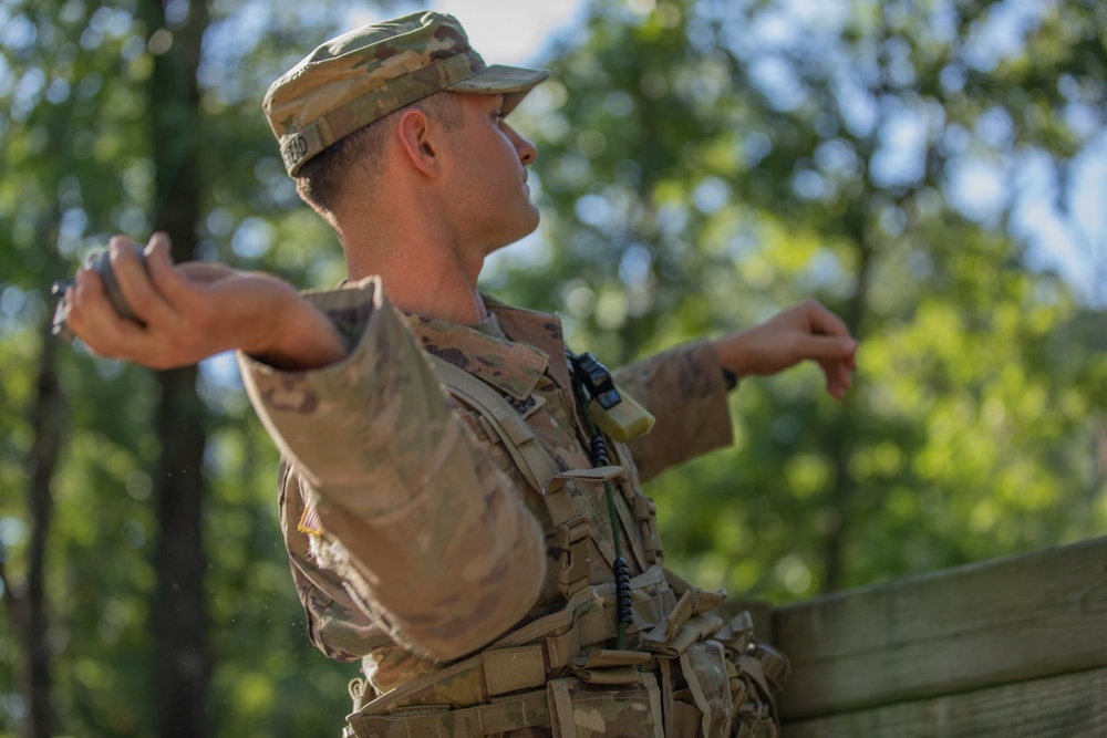 Sgt. James Ranstead throws an M67 training grenade.