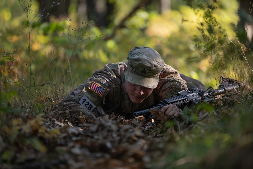 Sgt. James Ranstead low crawls through a trench