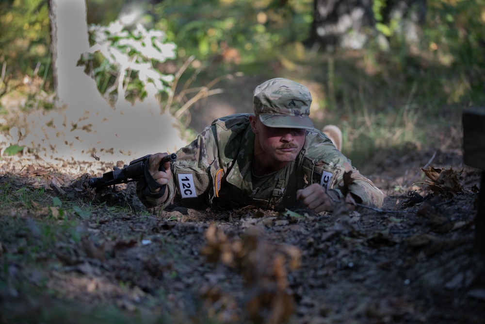 Cpl. Michael Glosemeyer low crawls through a trench.