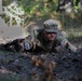 Cpl. Michael Glosemeyer low crawls through a trench.