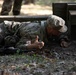 Cpl. Michael Glosemeyer simulates the steps a soldier takes prior to throwing a hand grenade.