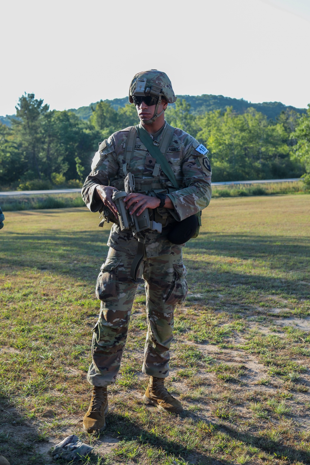 Spc. Jean Cruz attaches holster