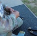 Spc. Nathaniel Wells reloads a magazine