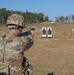 Spc. Nathaniel Wells shoots an M17 pistol