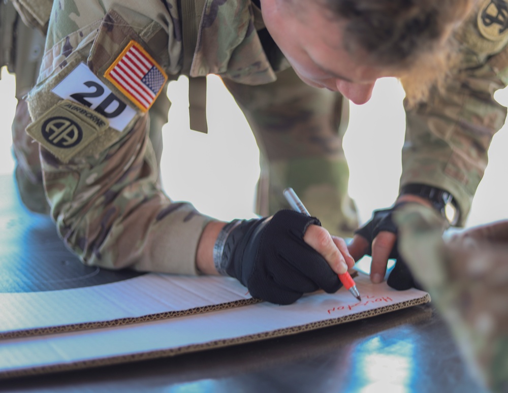 Spc. Carlin Houston marks his range card