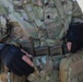 Spc. Carlin Houston fixes his M4 rifle magazines during the M17 pistol Excellence in Competition event.