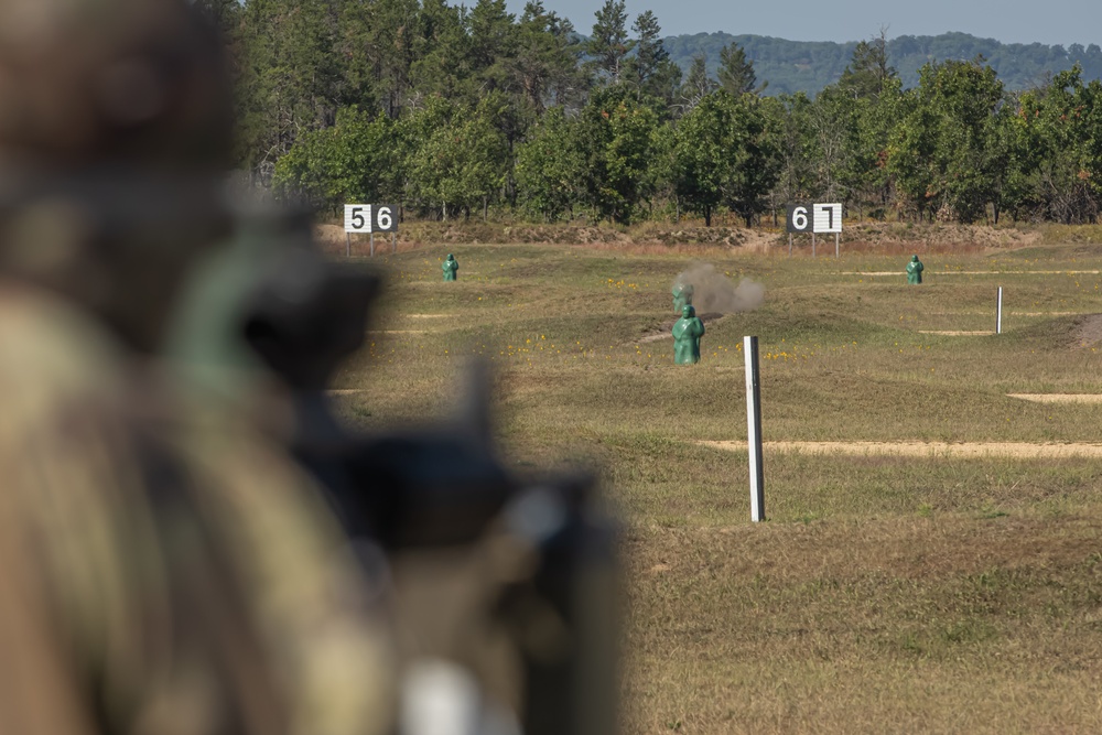 Spc. Antonio Henry fires at a target