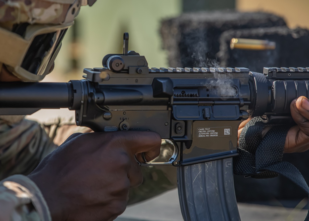 Spc. Antonio Henry fires at a target