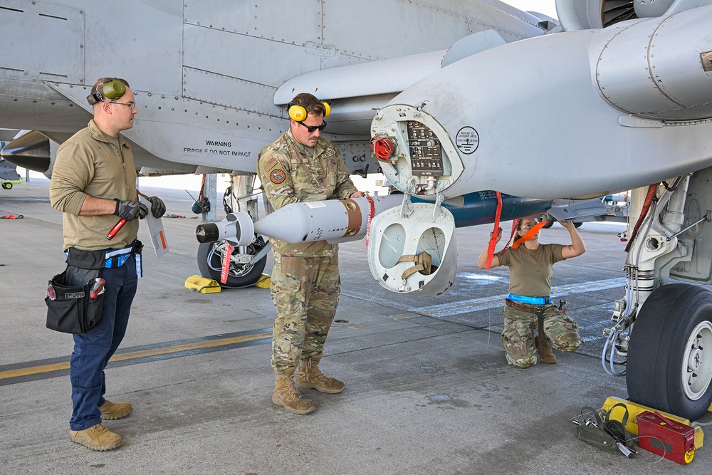 Load crew from 127th AMXS uploading a GBU-12 Paveway II