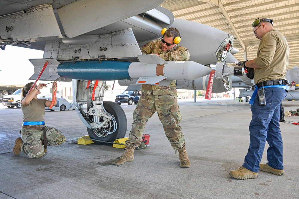 Load crew from 127th AMXS uploading a GBU-12 Paveway II