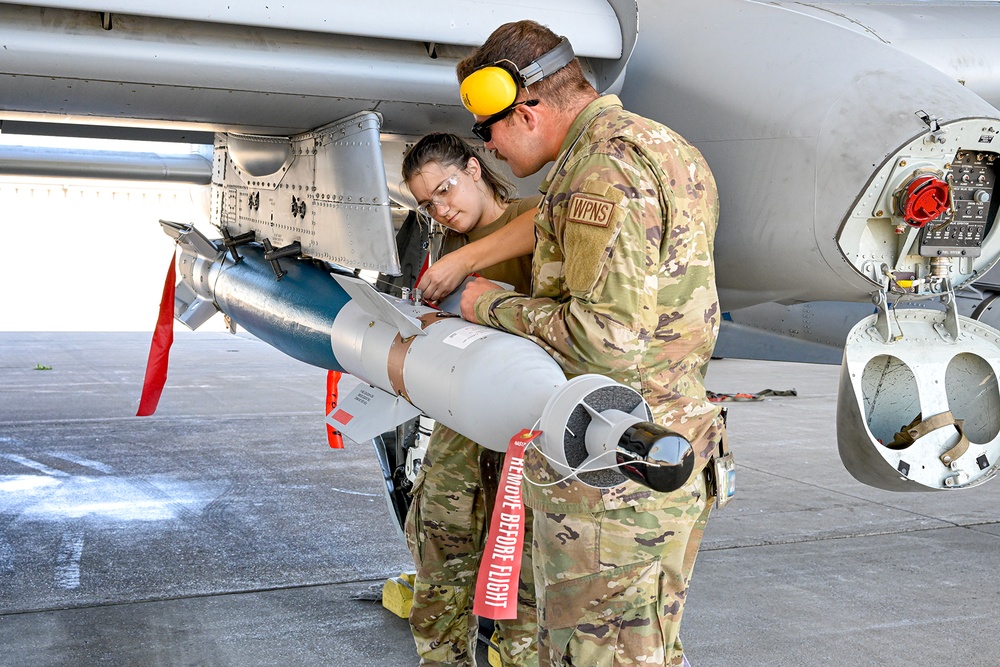 Load crew from 127th AMXS uploading a GBU-12 Paveway II