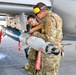 Load crew from 127th AMXS uploading a GBU-12 Paveway II