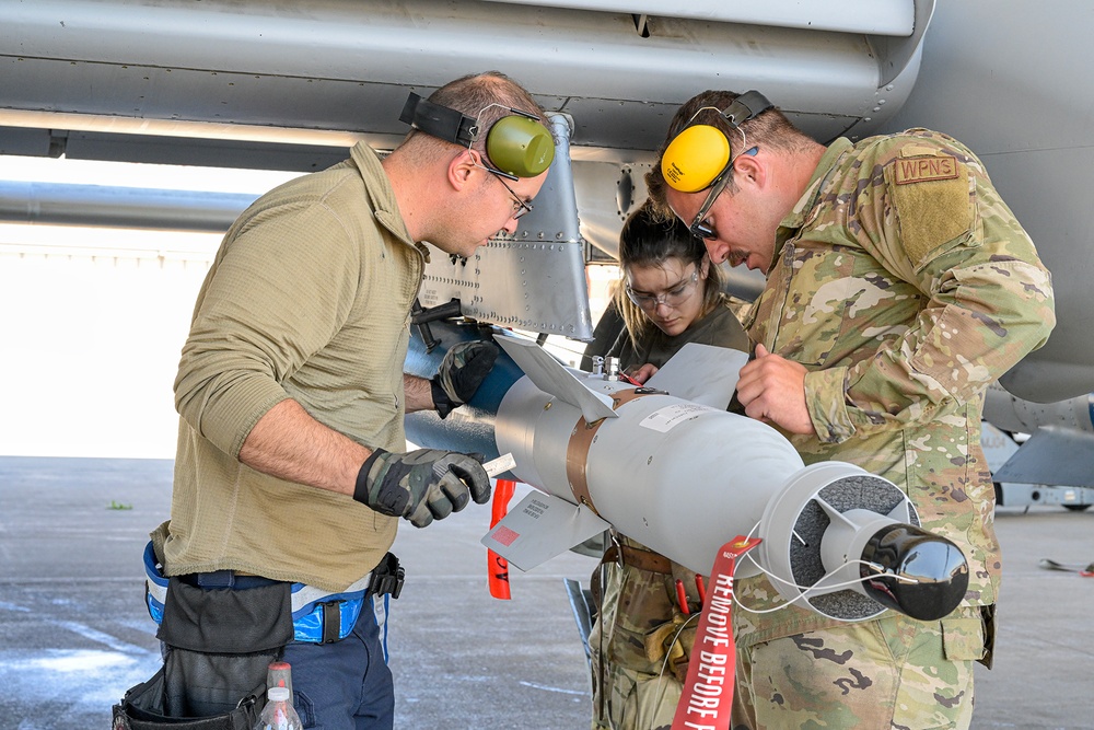 Load crew from 127th AMXS uploading a GBU-12 Paveway II