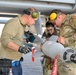 Load crew from 127th AMXS uploading a GBU-12 Paveway II